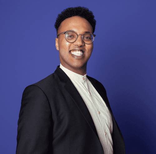 Man Smiling with purple background