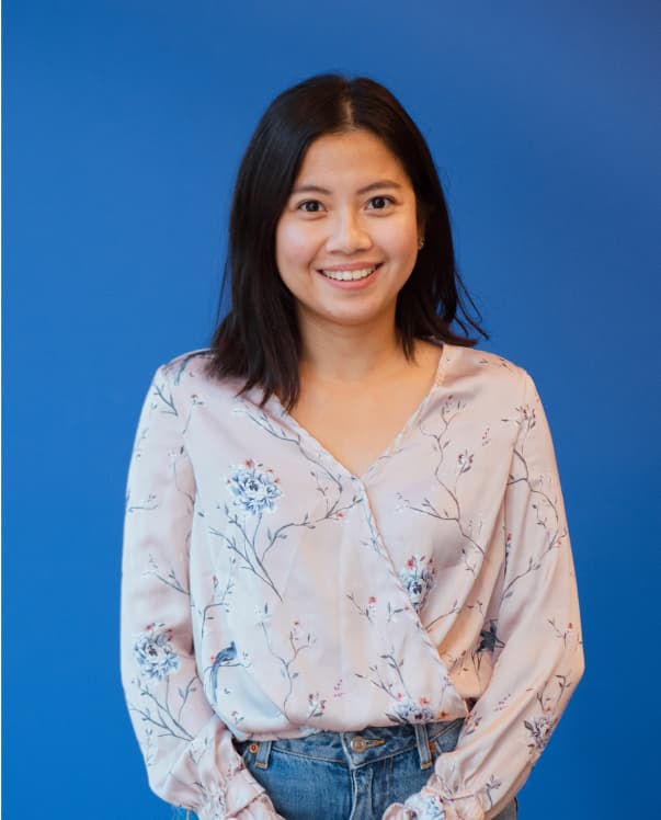 Woman standing with blue background