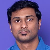 Portrait of a man wearing a blue shirt against a purple background