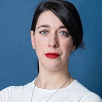Portrait of a woman against blue background