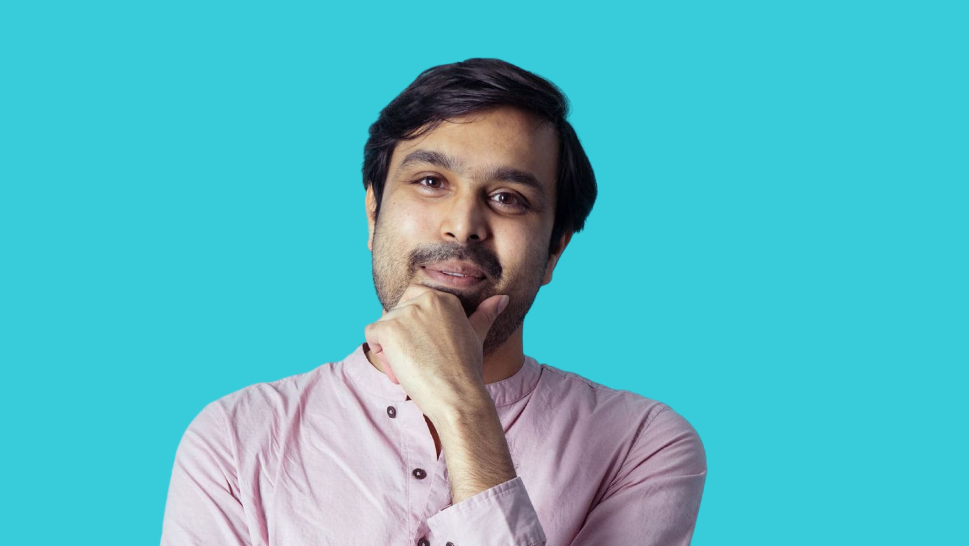 Portrait of a thoughtful man against a blue background