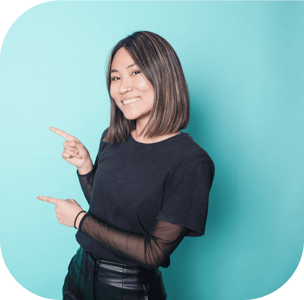 Woman pointing to the left against blue background